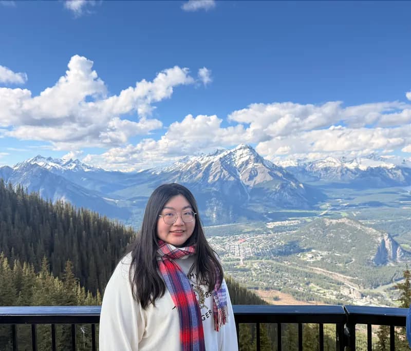 Wendy Huang, founder of Canadian Newcomer Hub, at the Banff gondola summit overlooking the Rockies